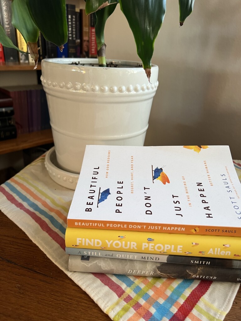A stack of four Christian books to read in 2023