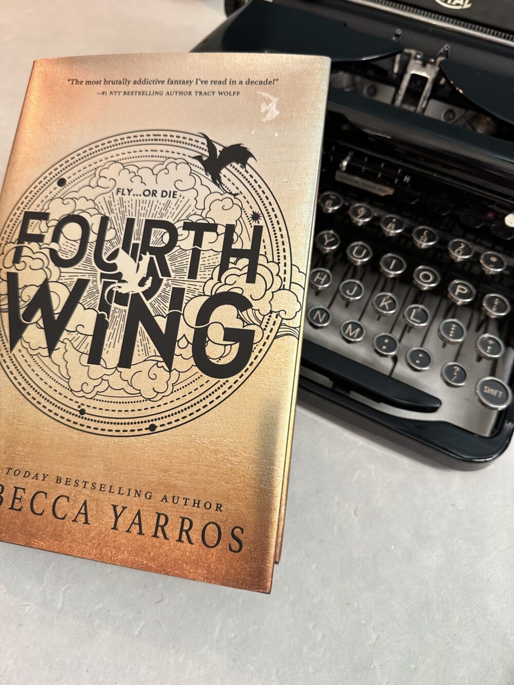 Fourth Wing Book and an Old Typewriter