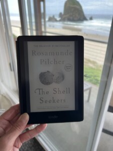 The Shell Seekers book with the ocean in the background