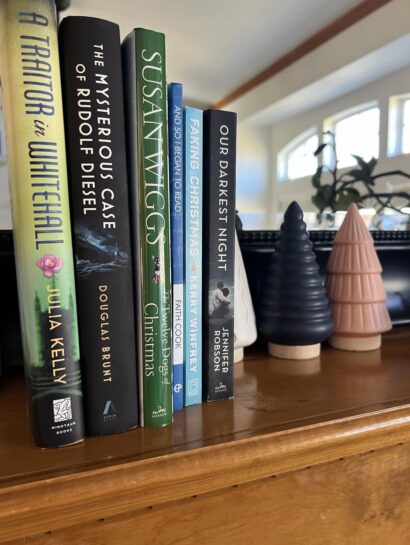 Stack of November reads on mantel