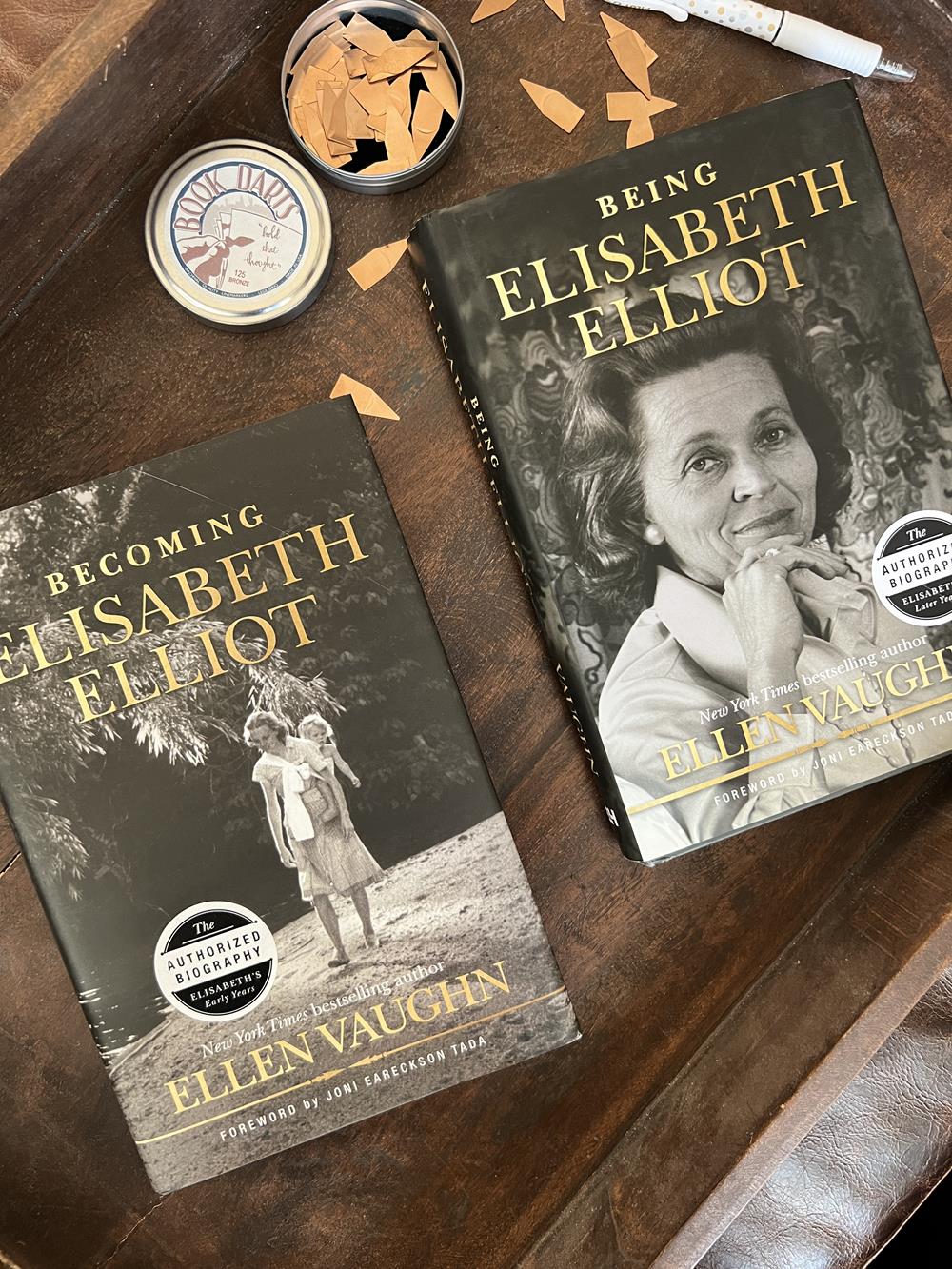 two books about Elisabeth Elliot on wood tray with book darts