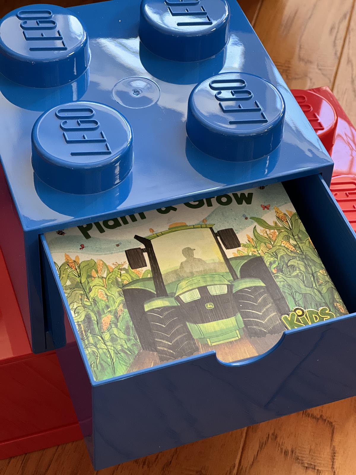 blue Lego storage box with kids books