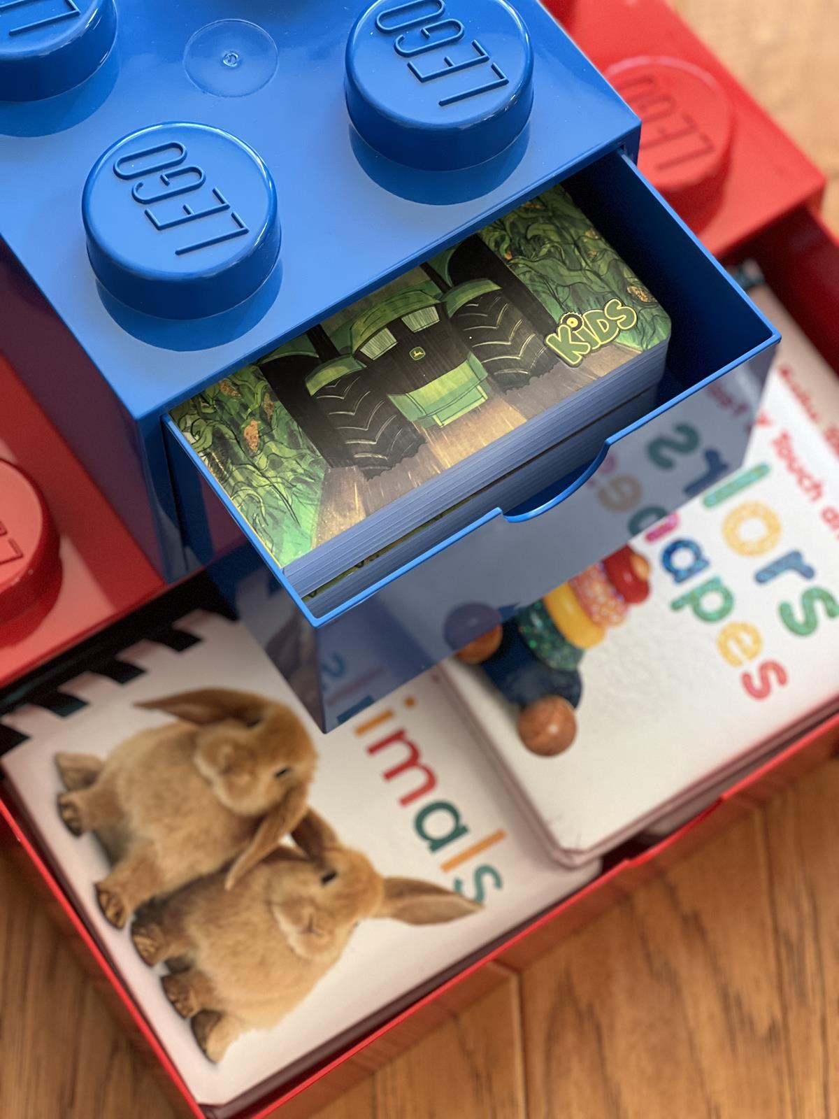 books for babies in a lego storage box for a Lego book gift