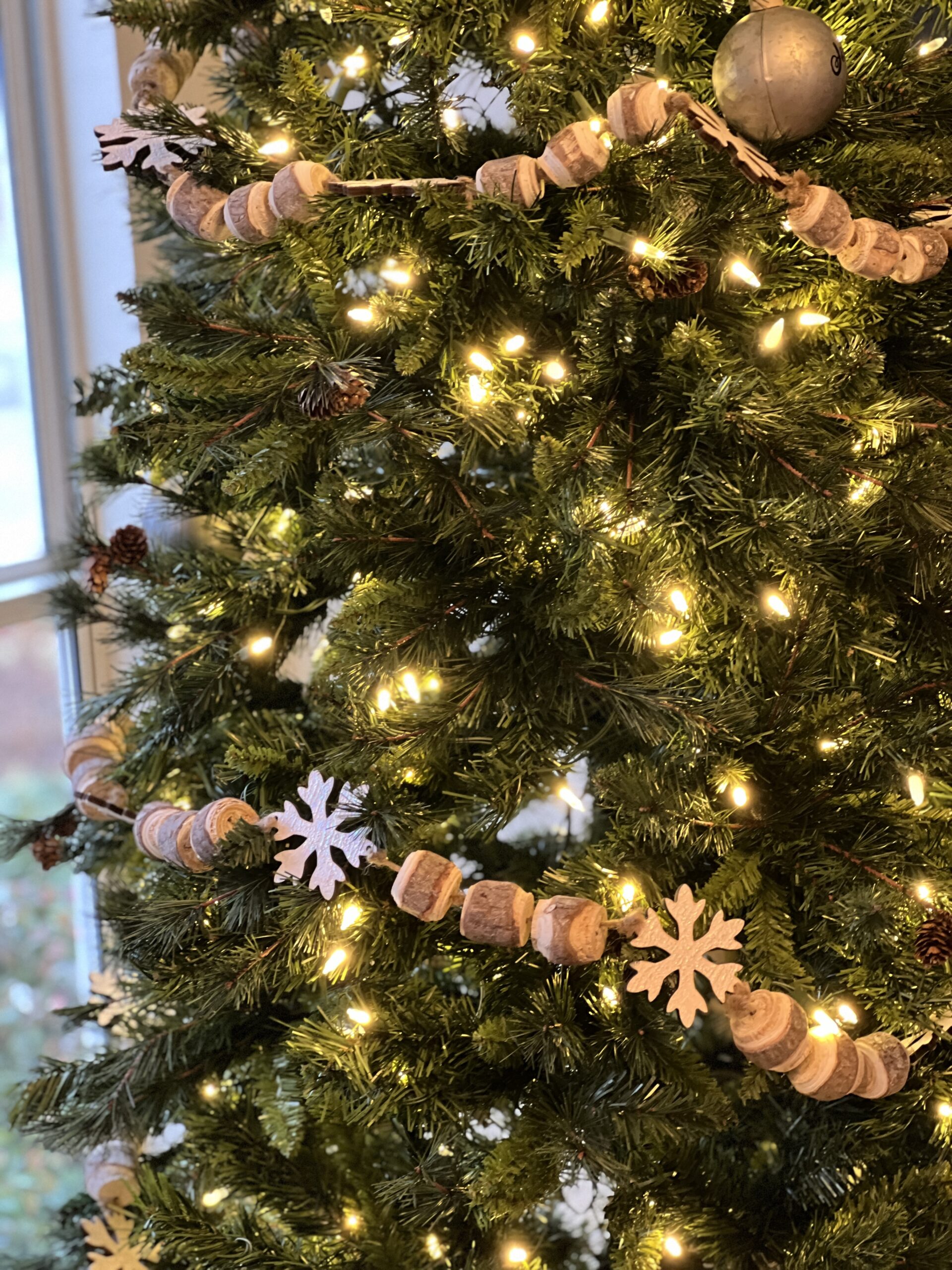 Christmas tree with lights and Christmas books