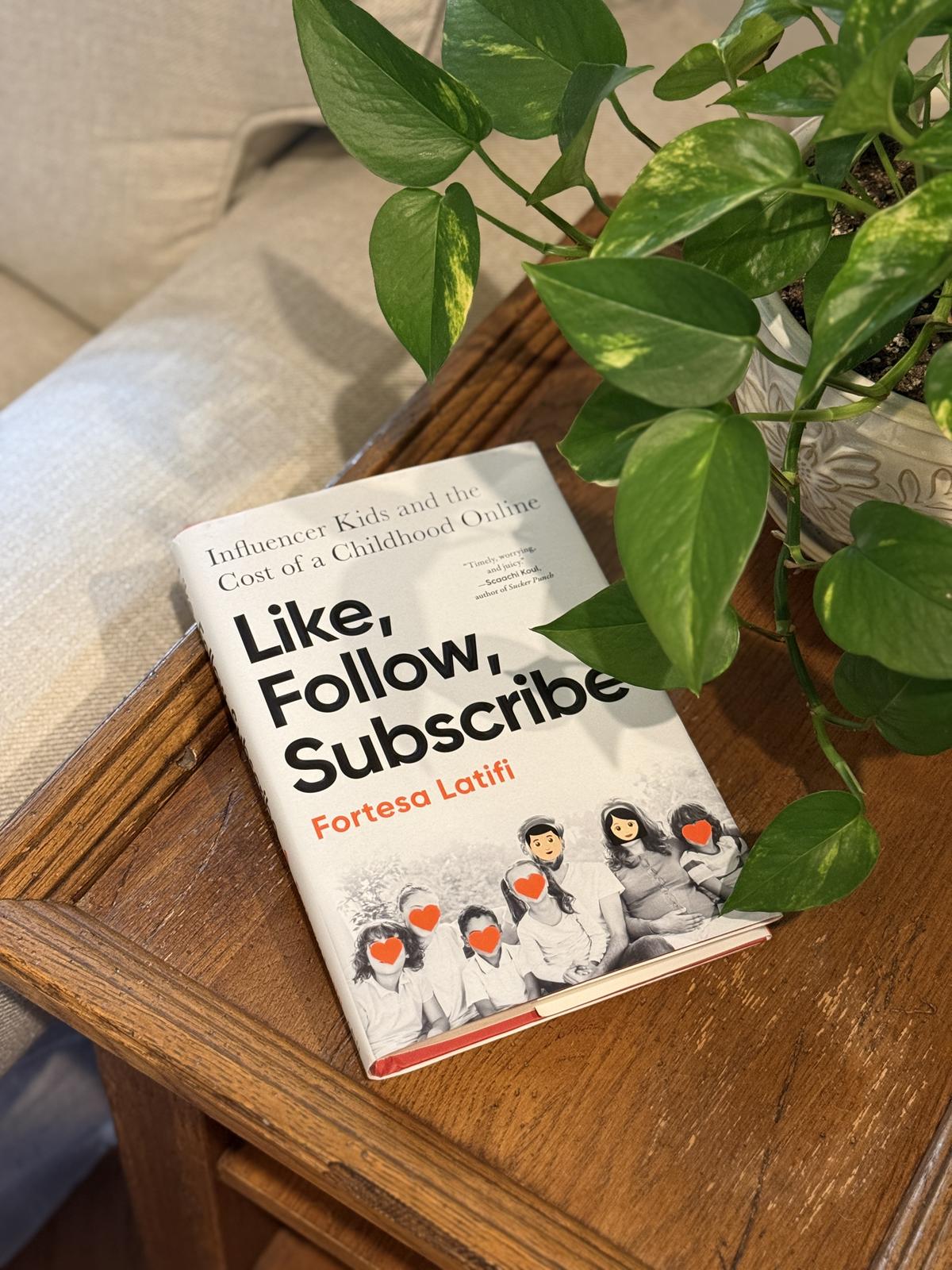 Like Follow Subscribe book by Fortesa Latifi on table